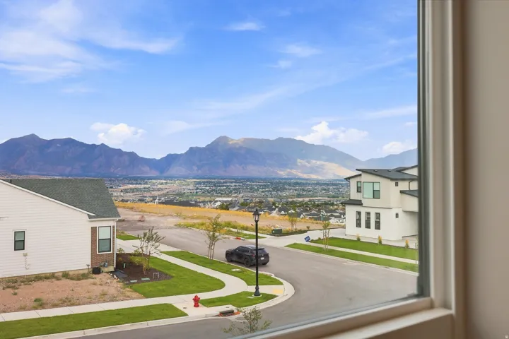 Expansive mountain range backdrop and distant city lights