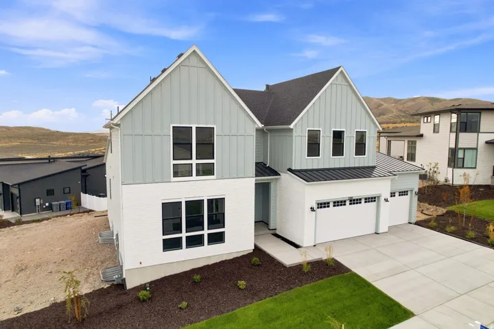 Contemporary architectural design featuring white brick and light blue vertical siding