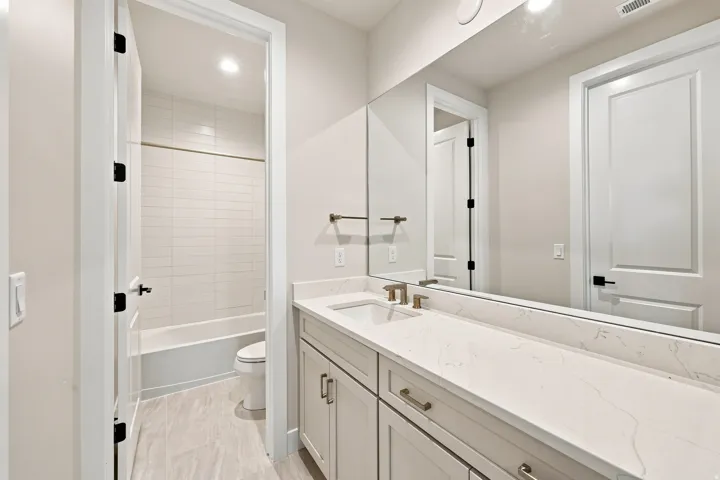 Extended vanity with an integrated sink and light-toned countertop