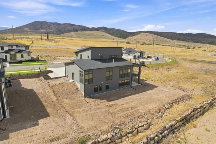 Modern architectural design with a flat roofline, extensive window placement, and a two-story exterior
