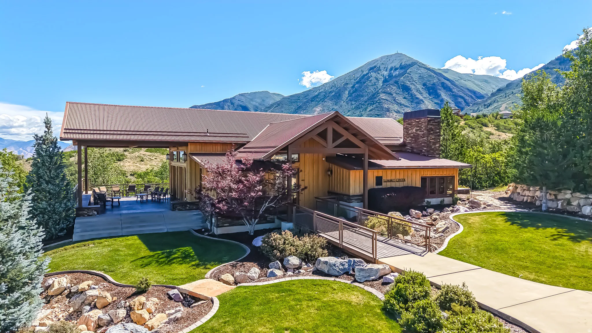 Wood-sided residence with a brown metal roof