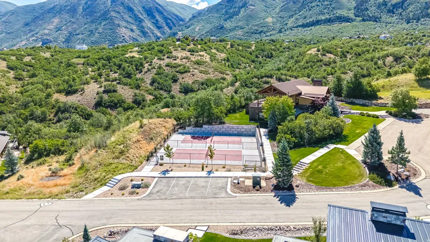 Professional-grade tennis and pickleball courts with paved surrounds