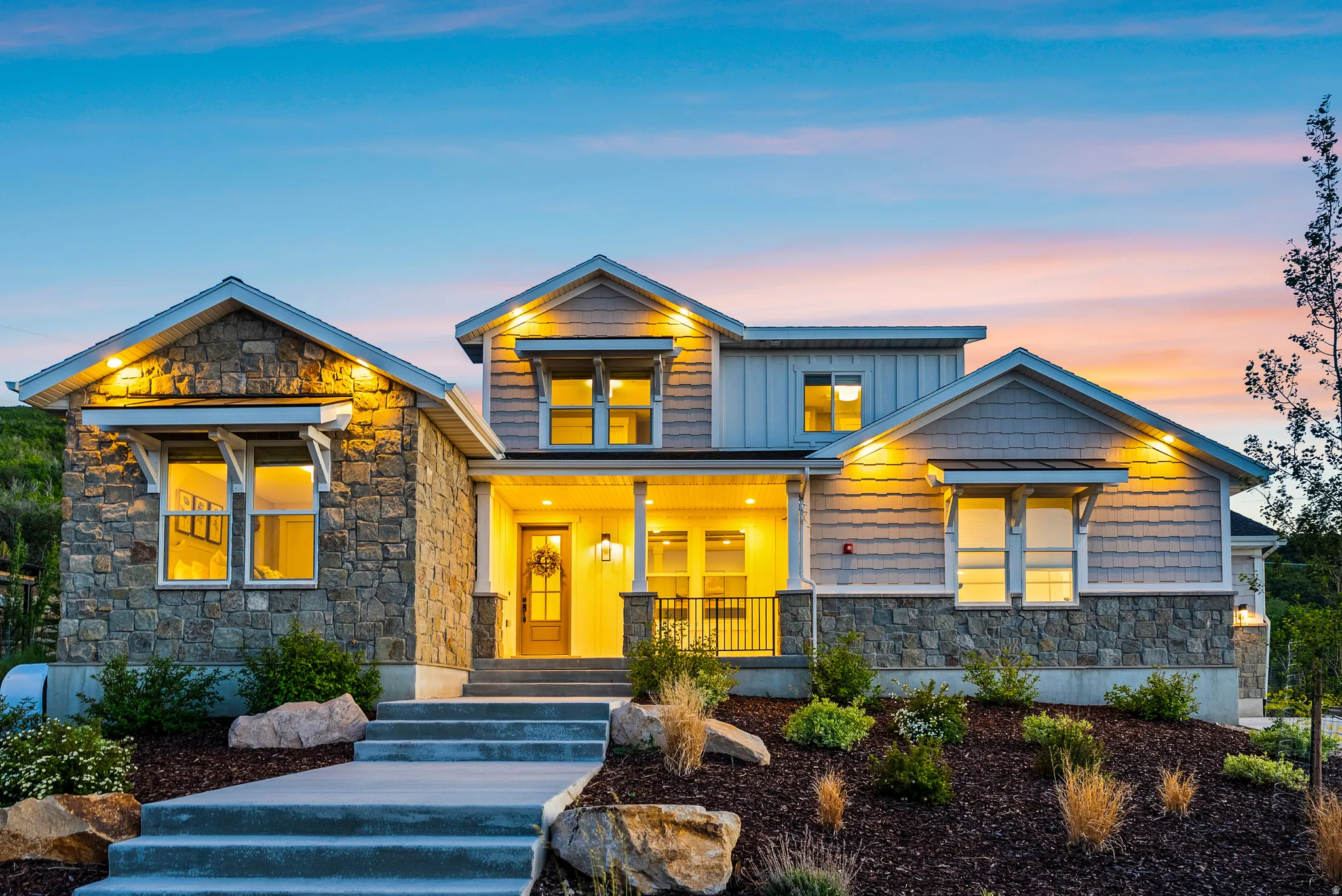 Stone and siding exterior with gabled roof lines
