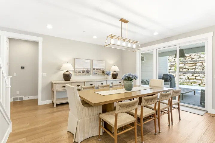 Dining area featuring wood-finish flooring and recessed lighting