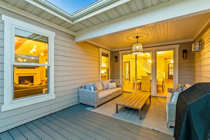 Covered patio featuring a wood-finish floor and horizontal siding