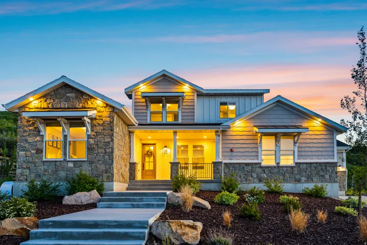 Stone and siding exterior with gabled roof lines