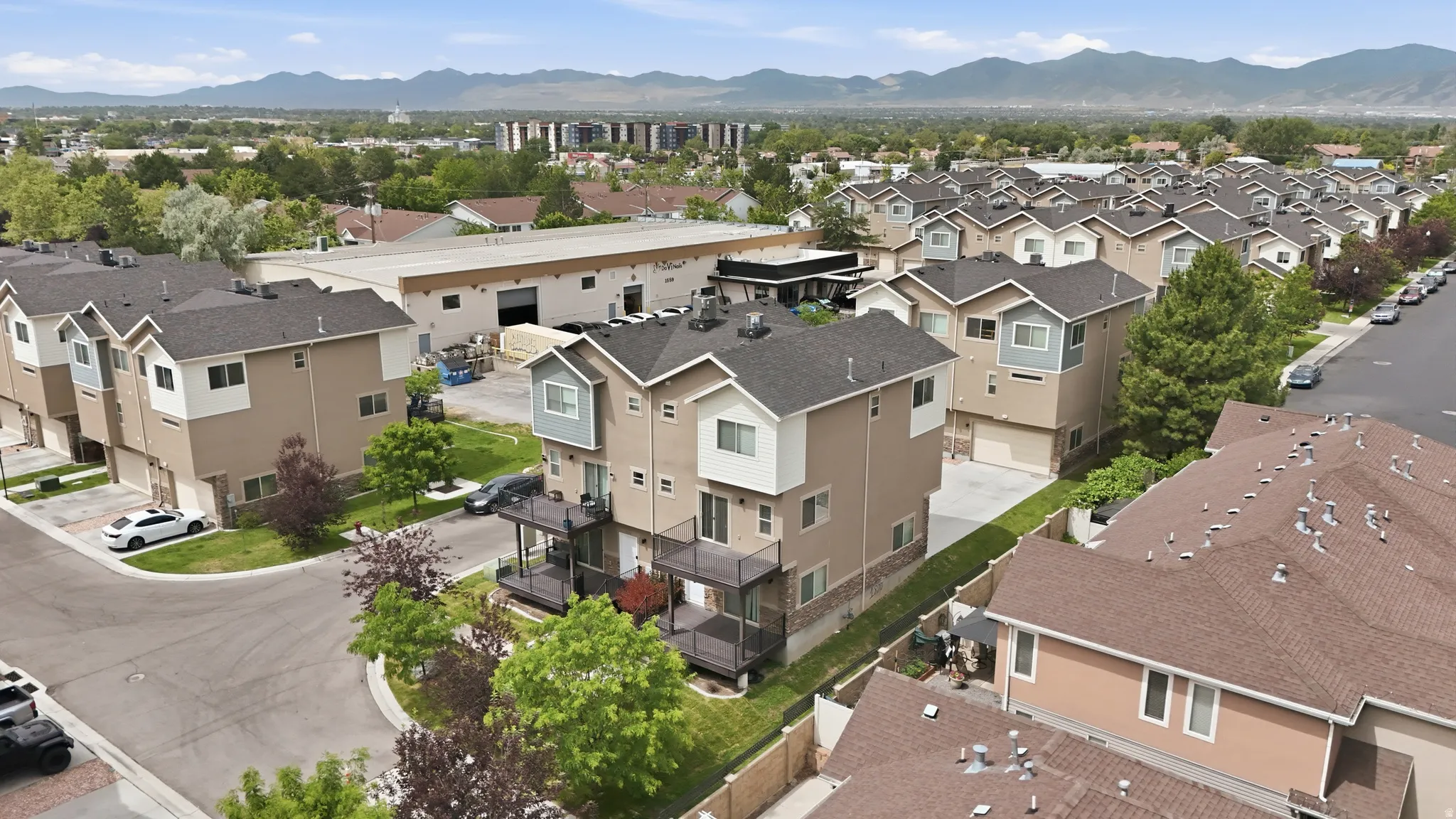 Contemporary residential complex featuring multi-story units with contrasting exterior finishes