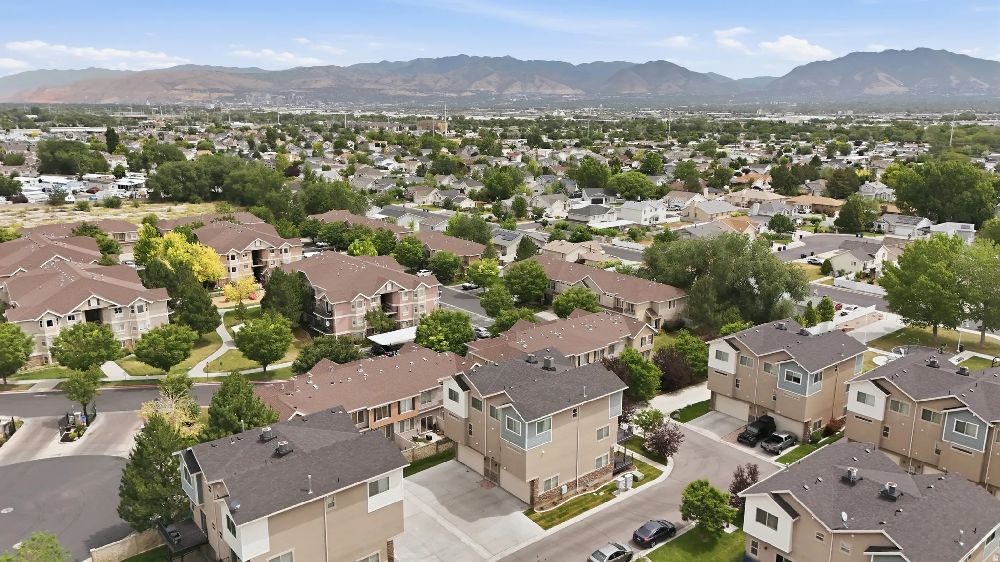 Expansive aerial perspective showcasing a residential area with varied housing types