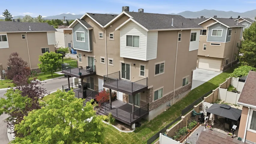 Multi-level townhome featuring stucco and horizontal siding finishes