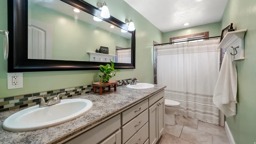Double vanity featuring oval sinks & brushed nickel faucets