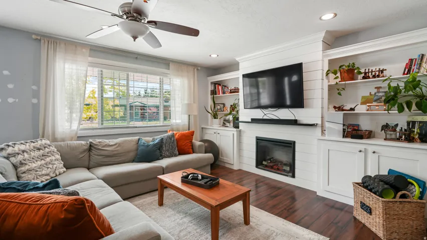 Living room with recessed lighting, and a ceiling fan