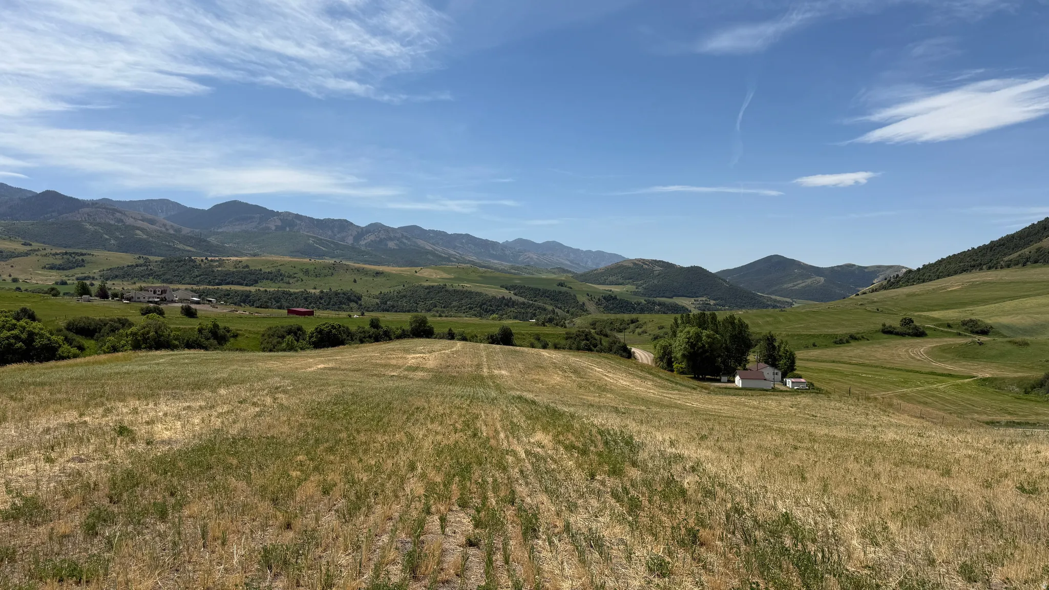 Expansive rural acreage featuring rolling hills and distant mountainous terrain