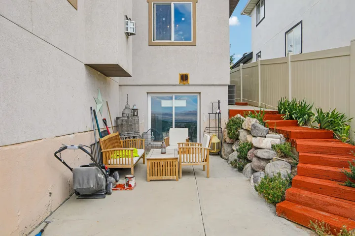 Concrete patio with sliding glass door access