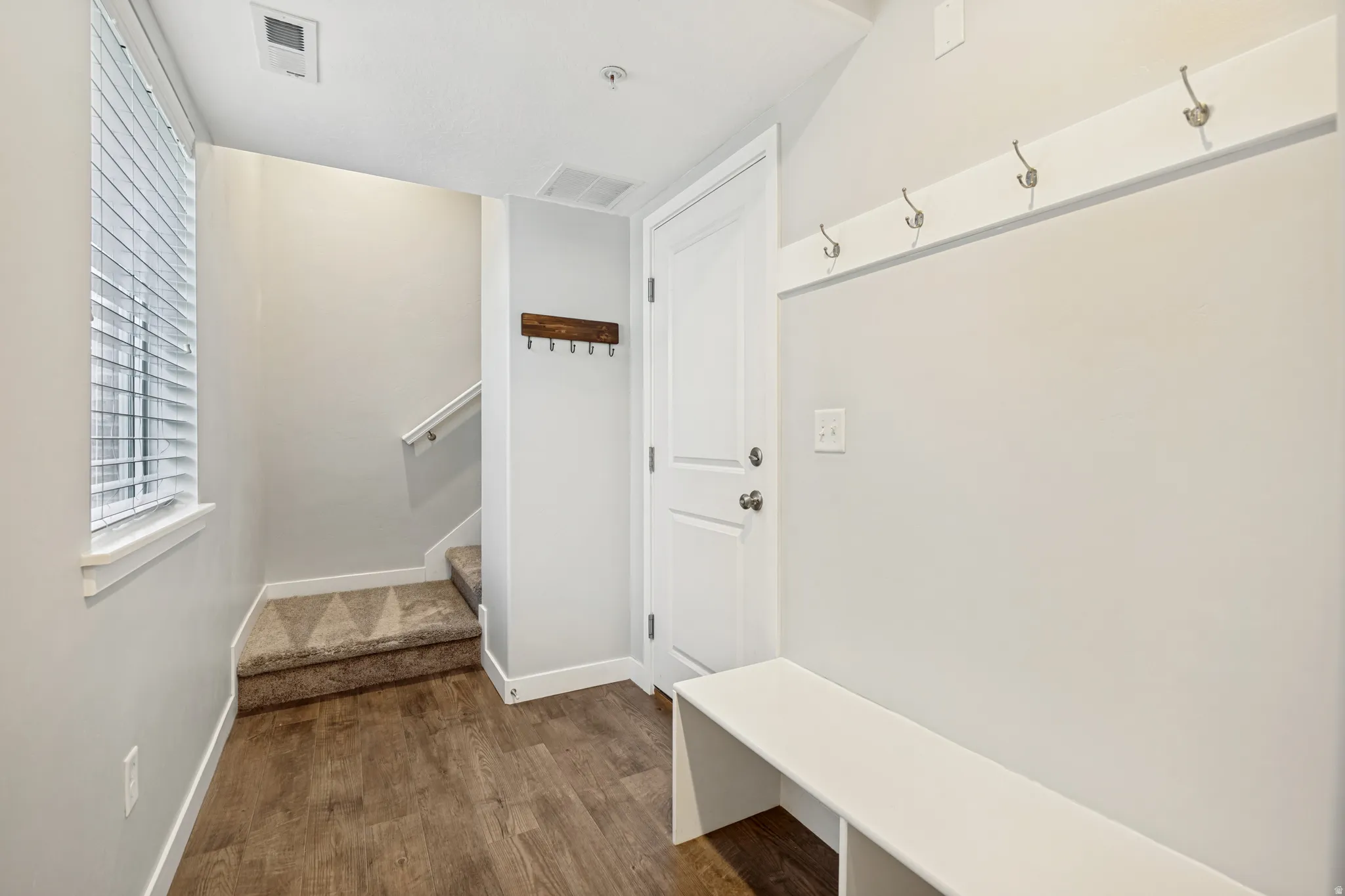A welcoming main-level entry leads to the garage and a well-placed mud room for everyday ease.