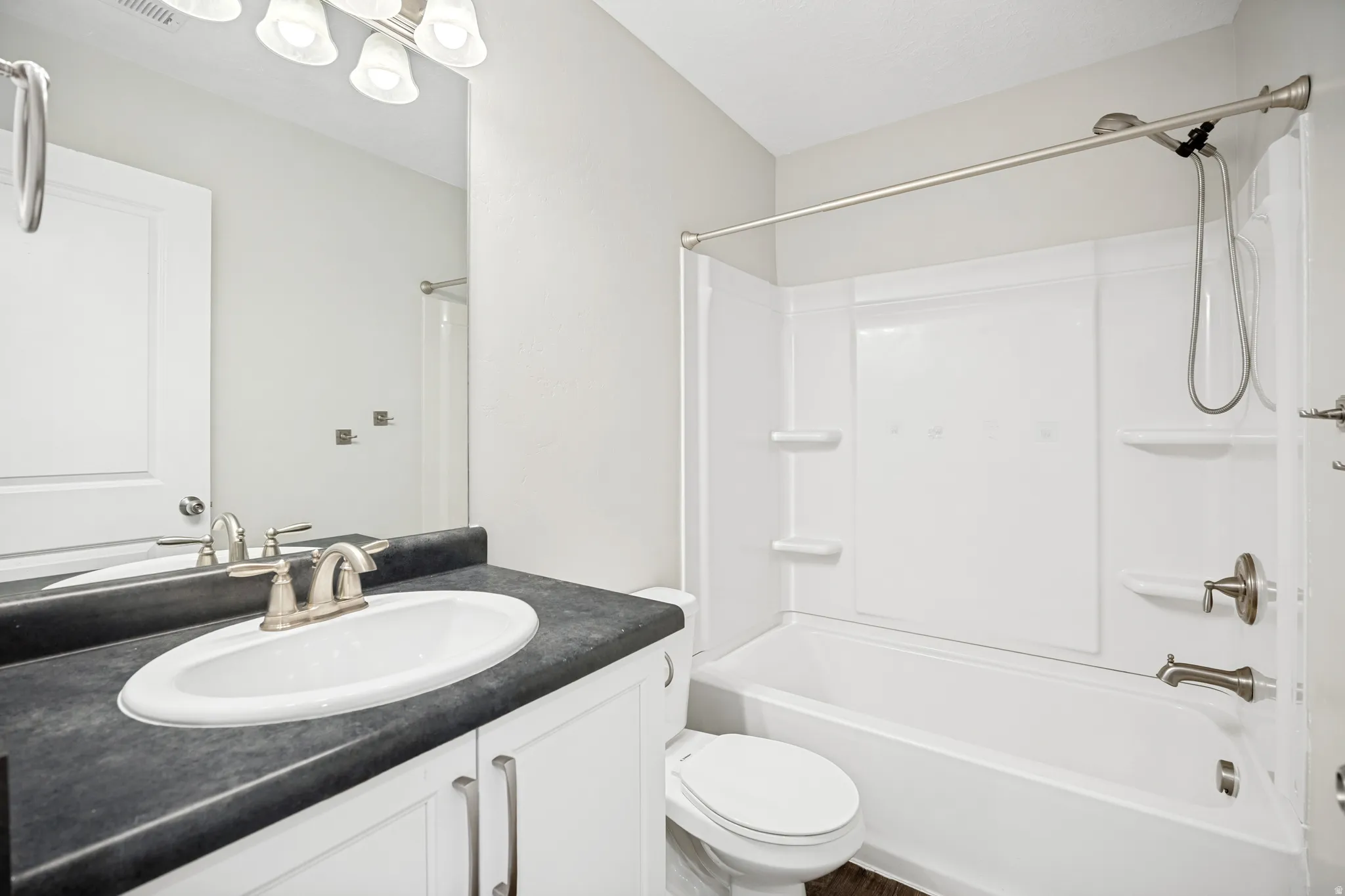 A full bathroom conveniently serves the two additional bedrooms on the third level