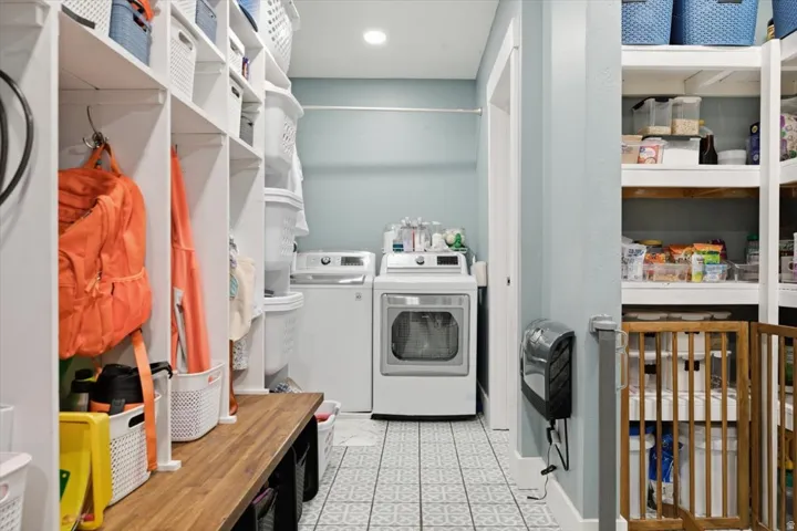 Dedicated laundry area featuring a washer and dryer set