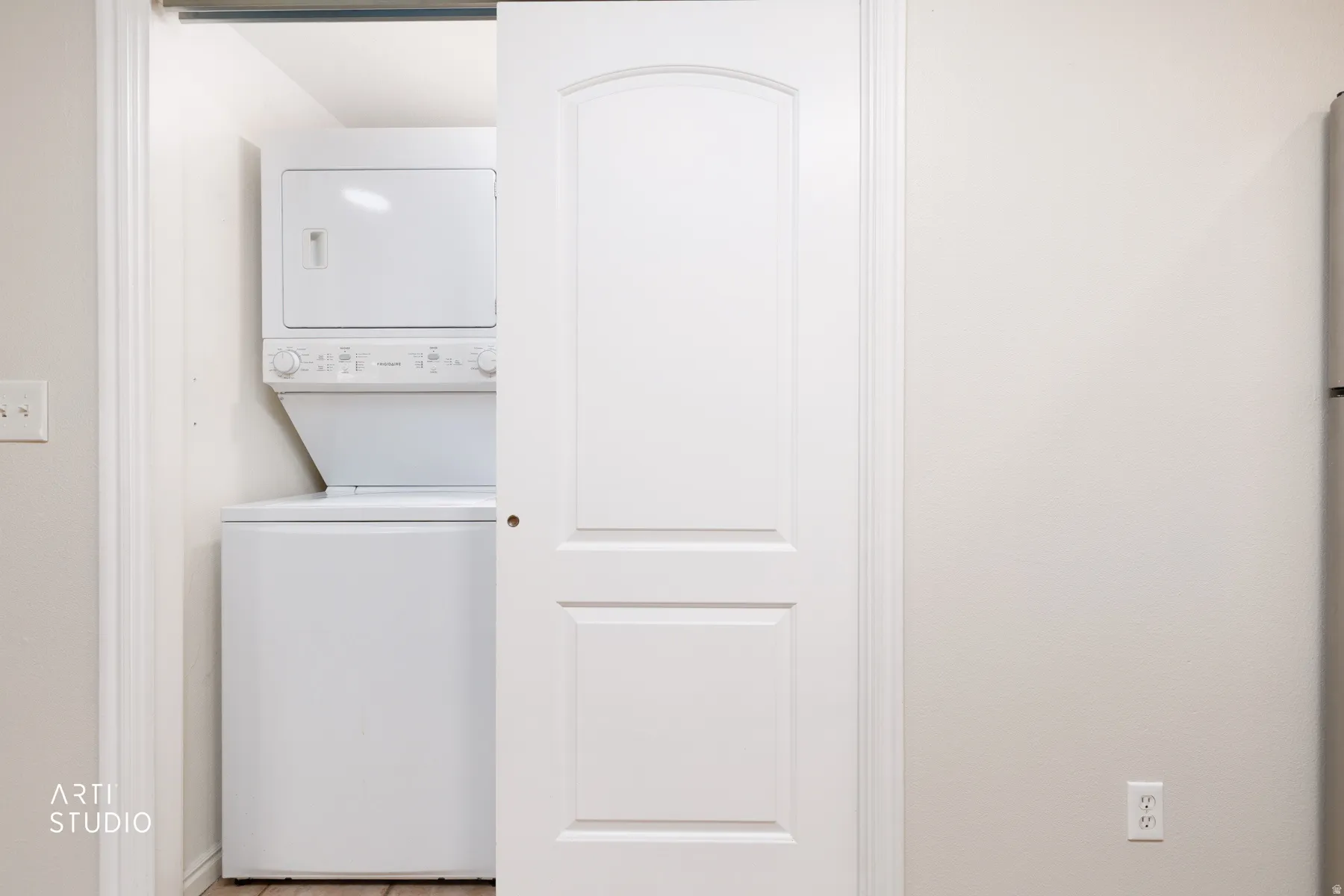 Stackable washer and dryer unit in a dedicated closet