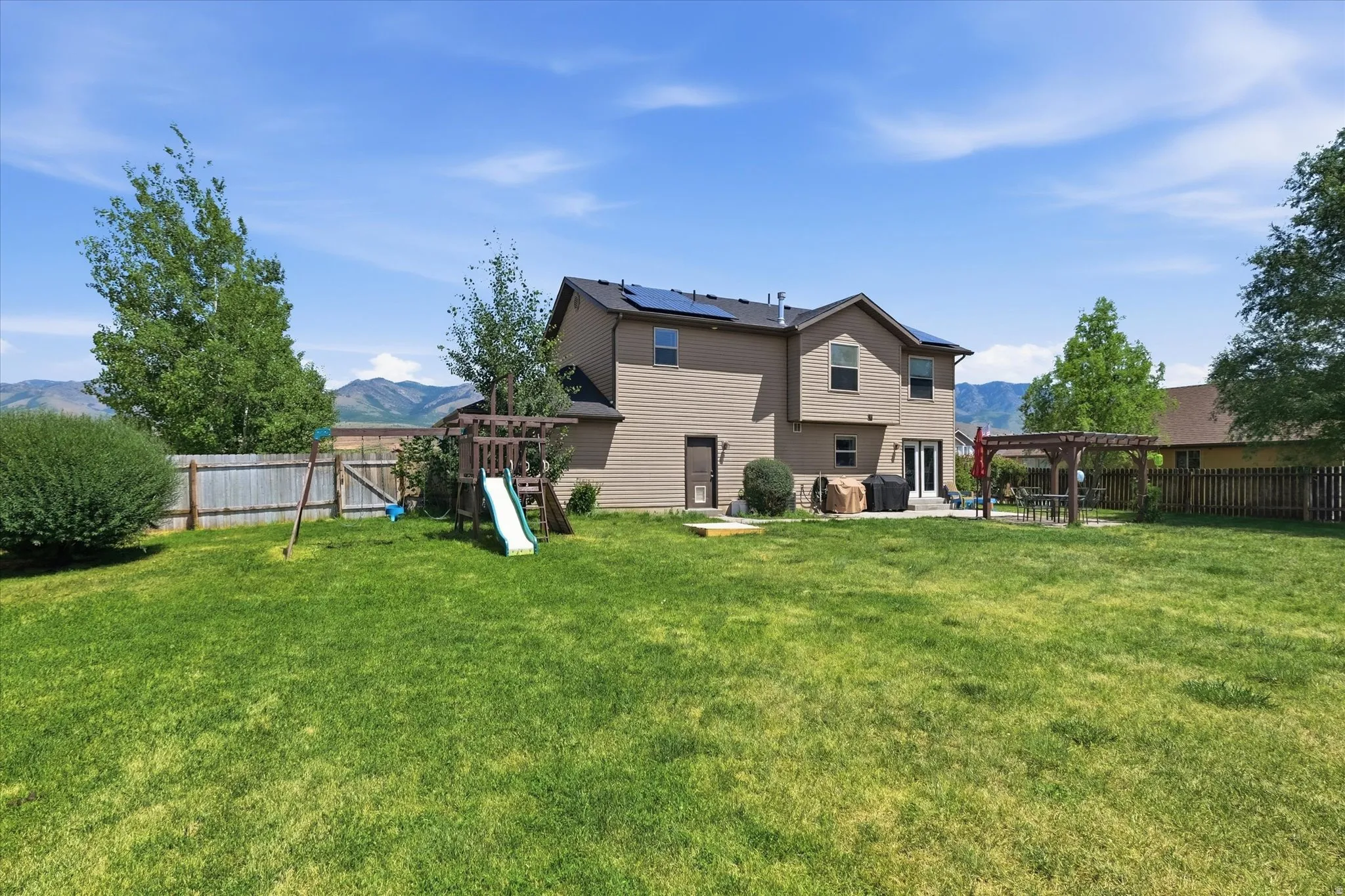 Expansive green lawn providing ample outdoor space