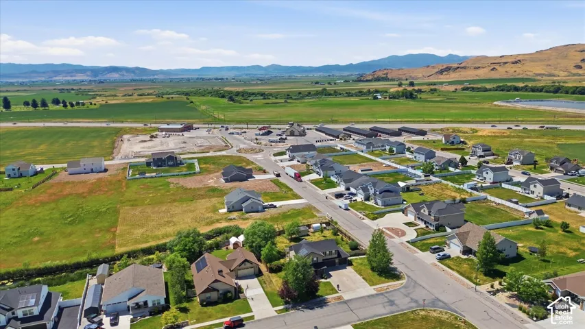 Aerial perspective showcasing a residential development with established homes and new construction sites