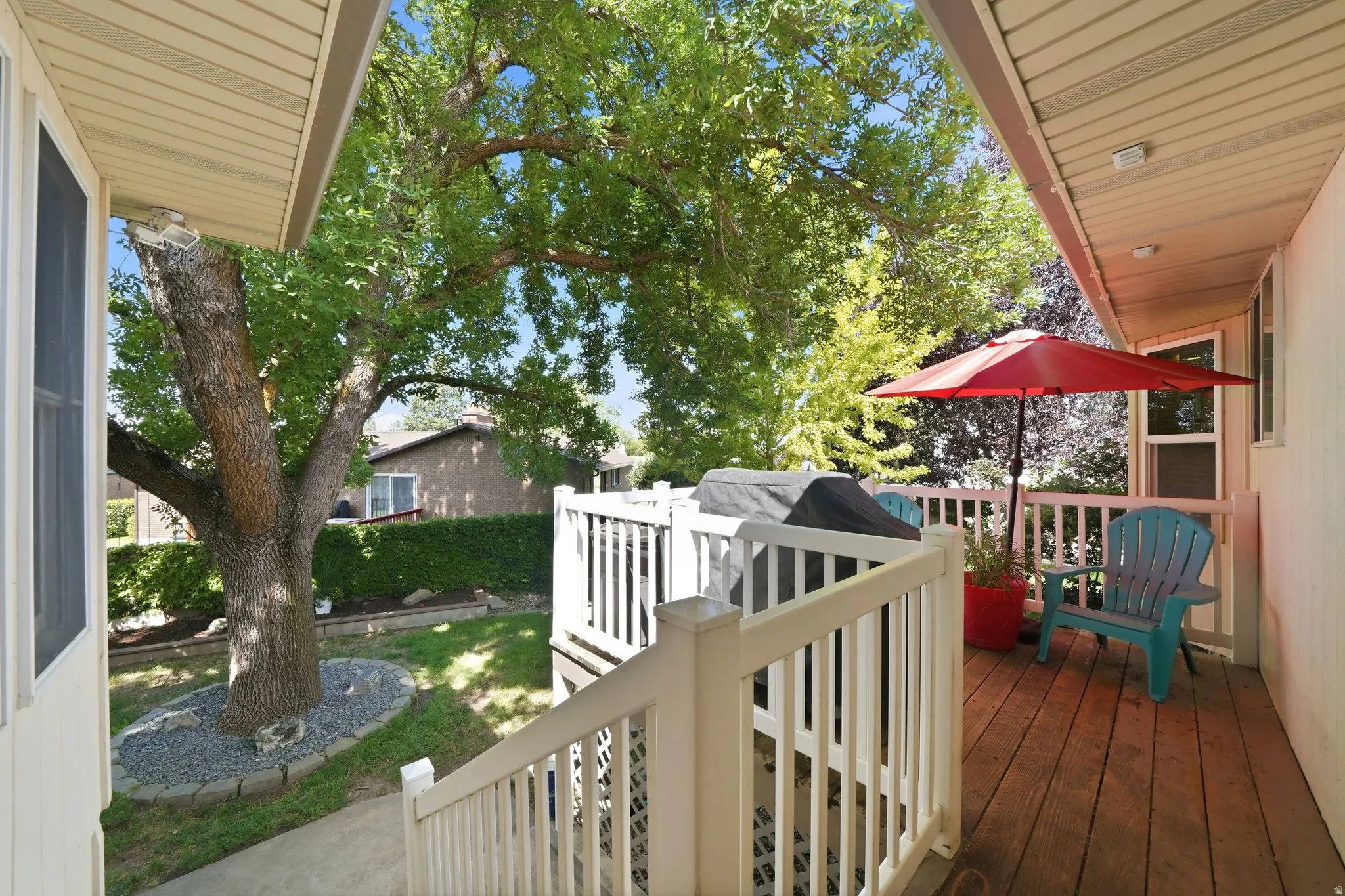 Outdoor deck with and white railings