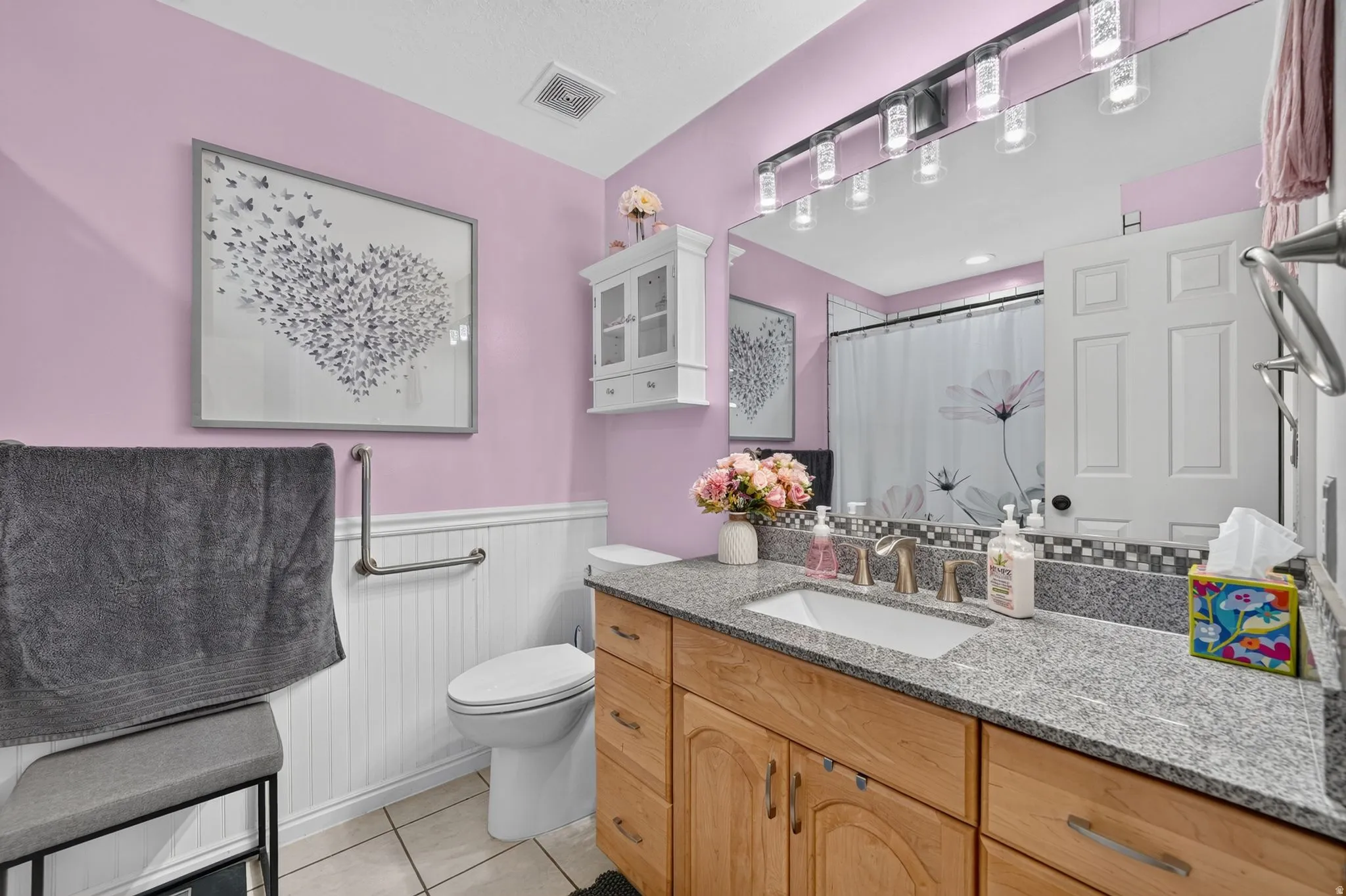 Full Bathroom featuring a granite countertop vanity with a rectangular undermount sink and brushed nickel faucet