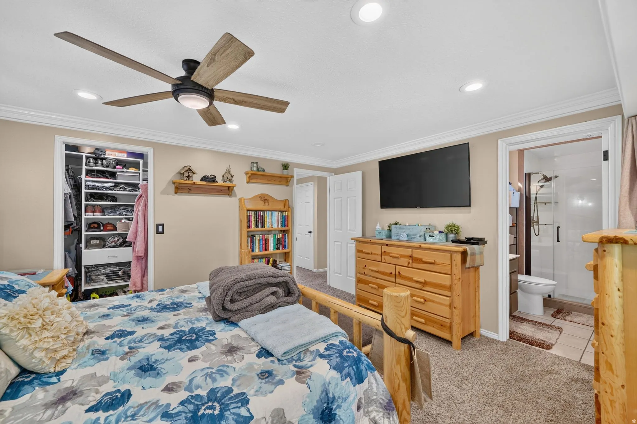 Bedroom featuring a ceiling fan with light, recessed lighting, and crown molding