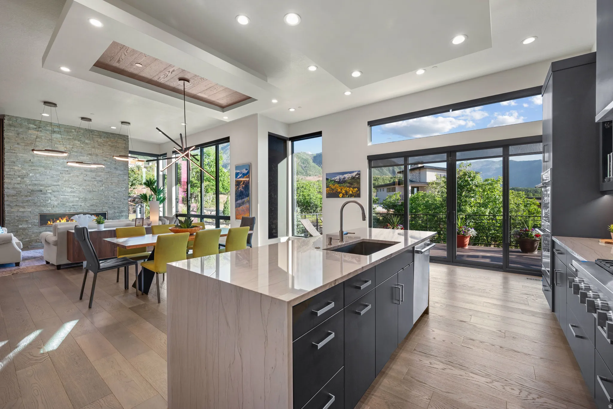 Open-concept living space with sliding glass doors leading to the deck.