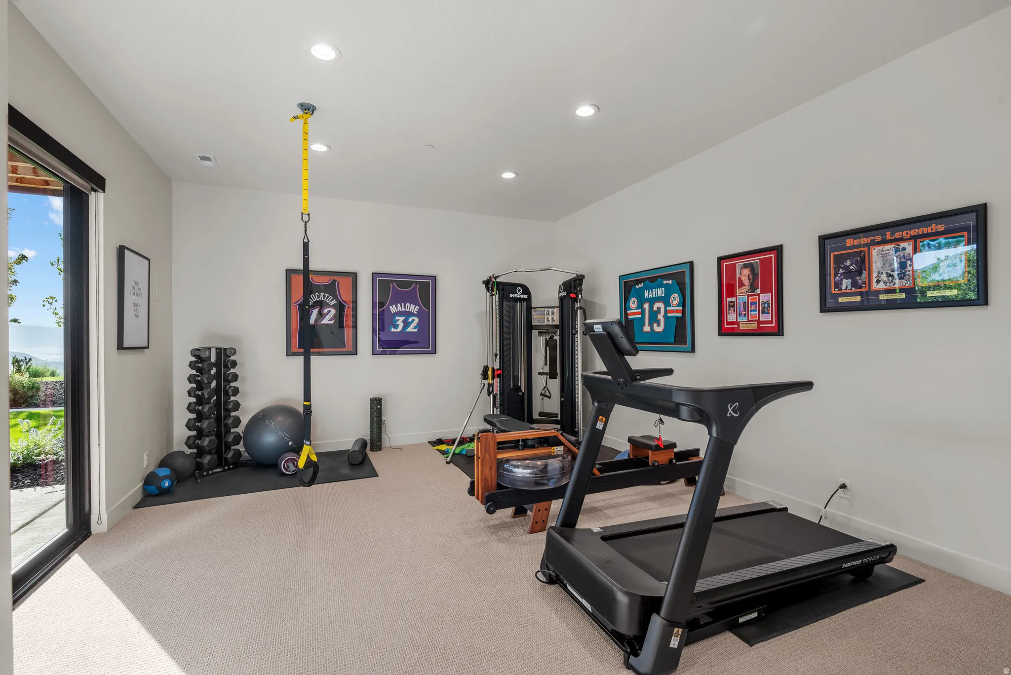Bedroom 2 (or exercise room).  Large room with access to the back patio.
