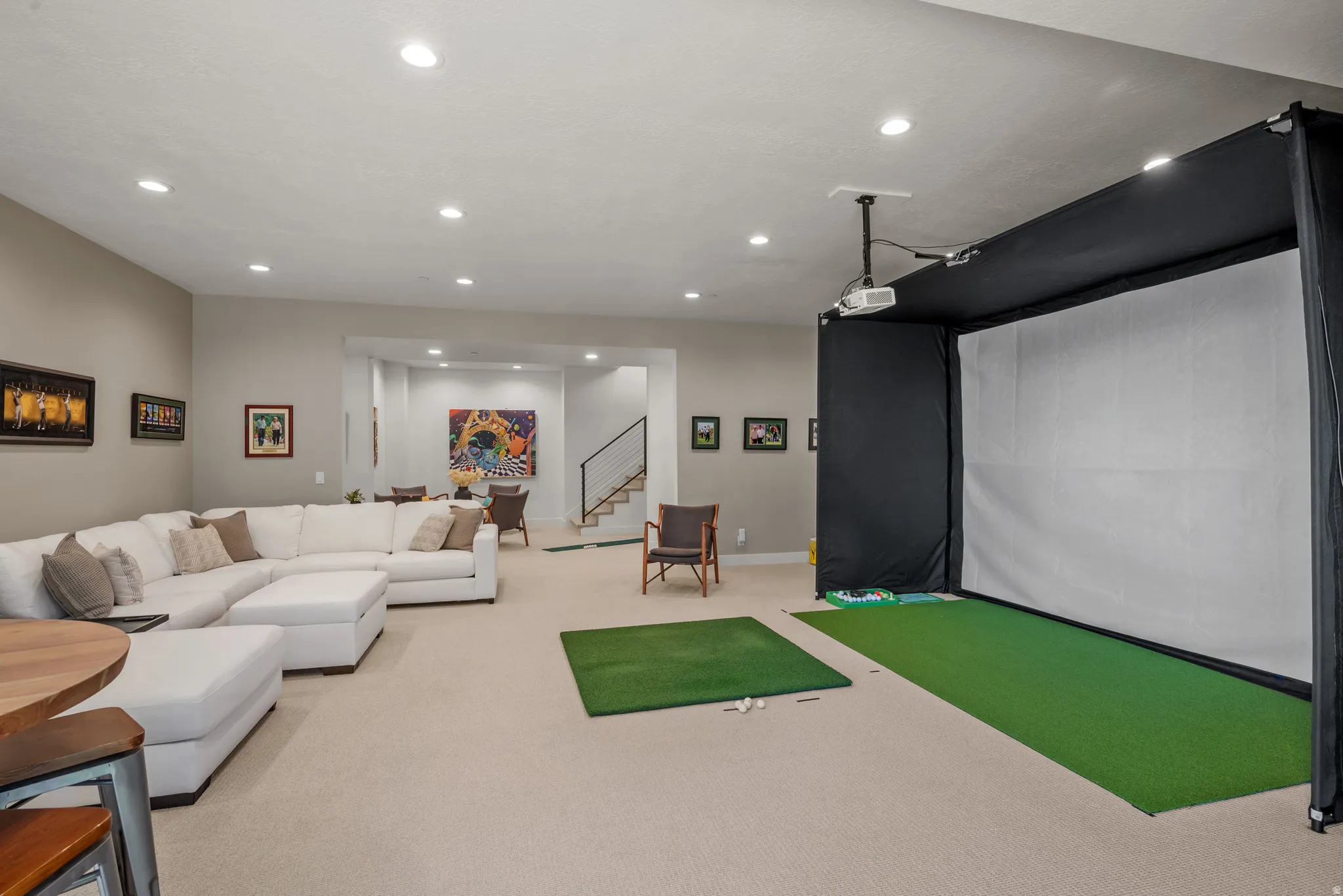 Spacious open family room with a golf simulator (negotiable if you would like to keep)