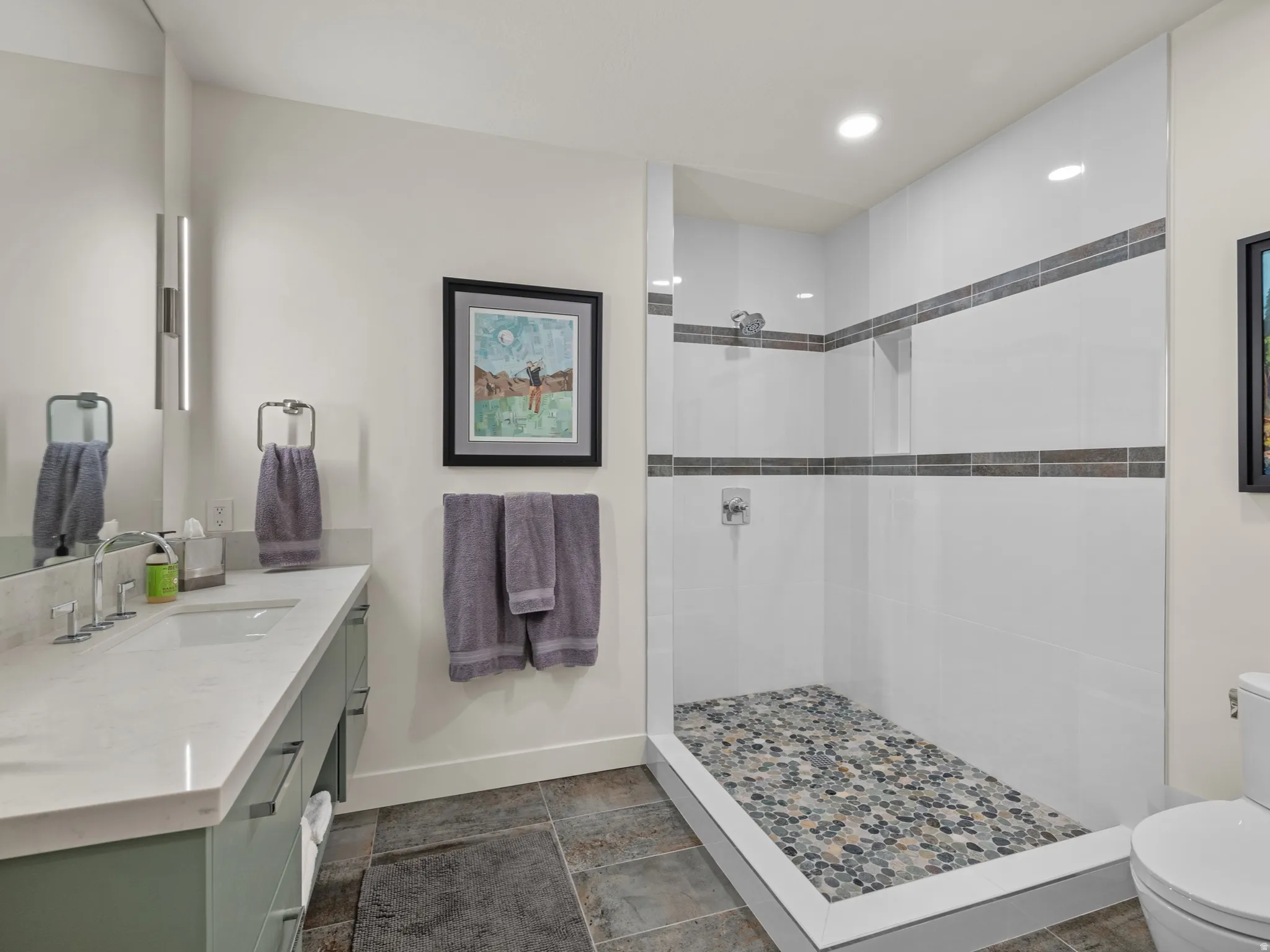 Contemporary bathroom with an open shower.