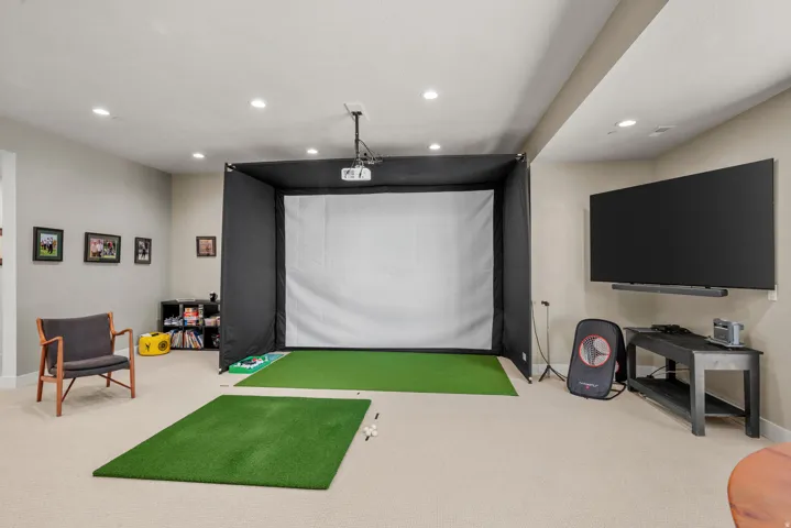 Basement family room with golf simulator (negotiable if you would like to keep).  Lots of room for the family to gather.