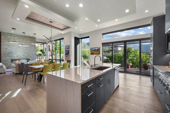 Open-concept living space with sliding glass doors leading to the deck.