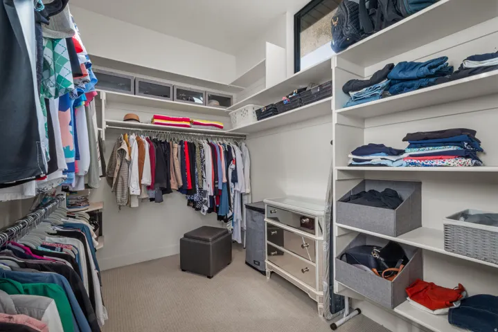 Primary closet with ample storage