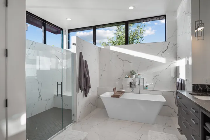 Primary bathroom with walk-in shower and freestanding tub