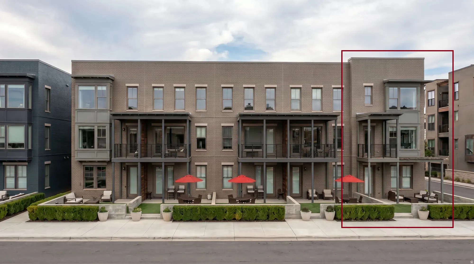 Contemporary multi-story exterior with brick and paneling finishes