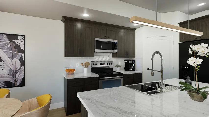 Kitchen featuring knotty alder cabinetry, stainless steel appliances, a "Working Pantry with countertop inside and outlets for toaster, blender, mixer, etc., and quartz countertops