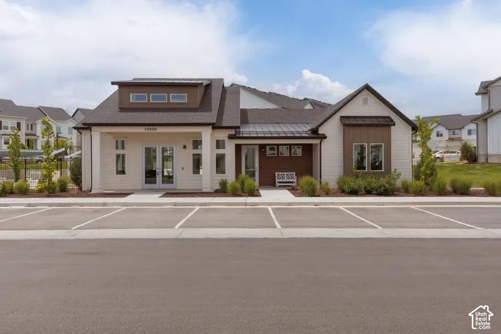 Contemporary facade featuring a mix of horizontal siding and vertical paneling