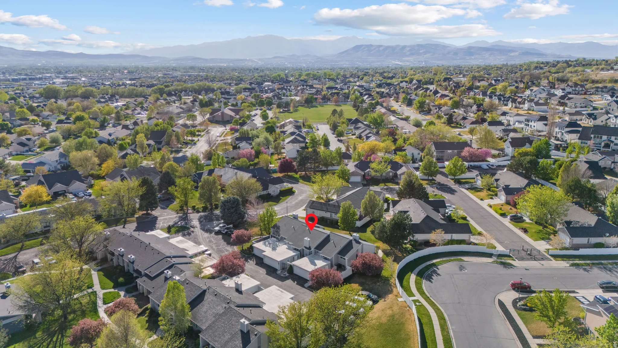 Aerial perspective showcasing a residential community with mature landscaping