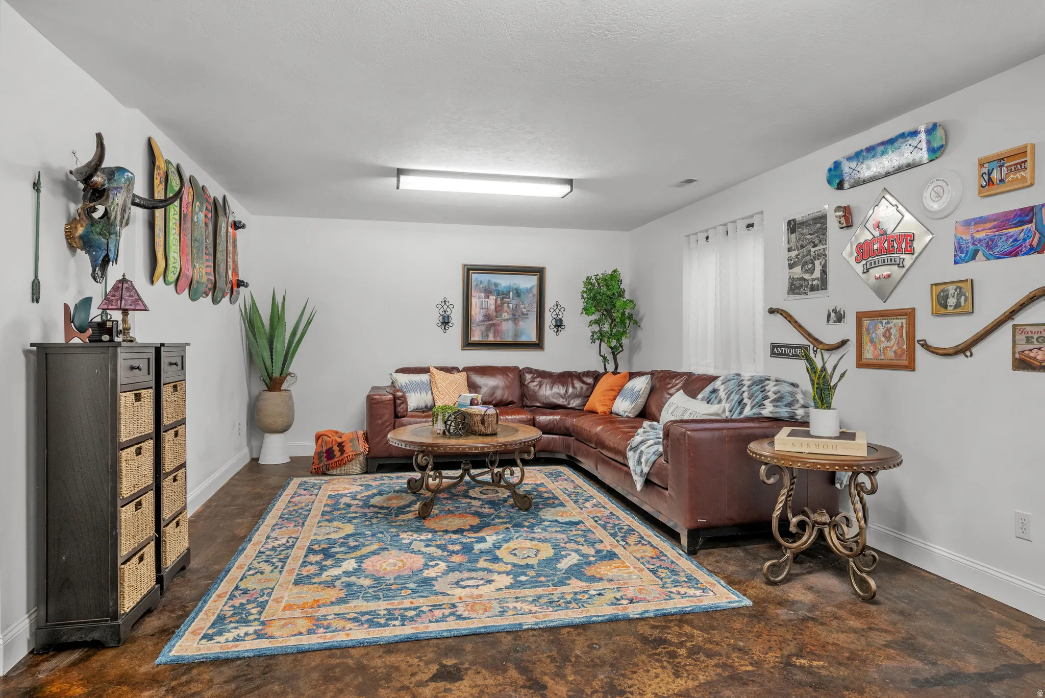 Basement family room with polished stained concrete floors