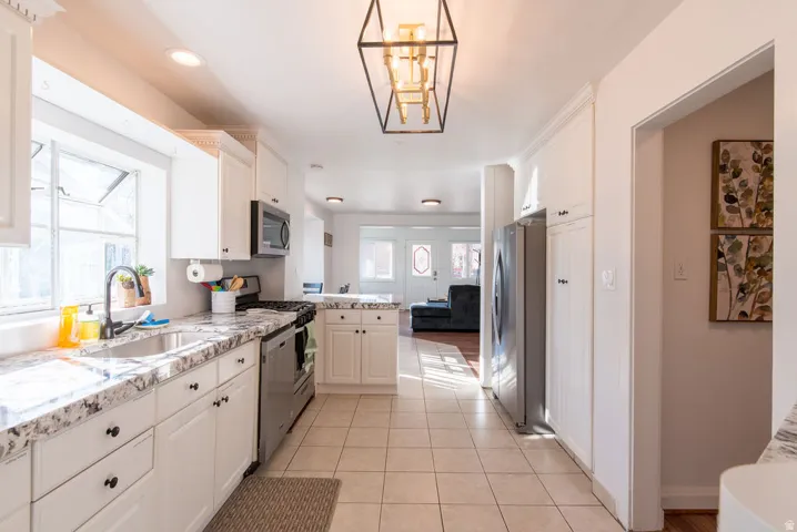Bright kitchen with white cabinetry and light-toned countertops