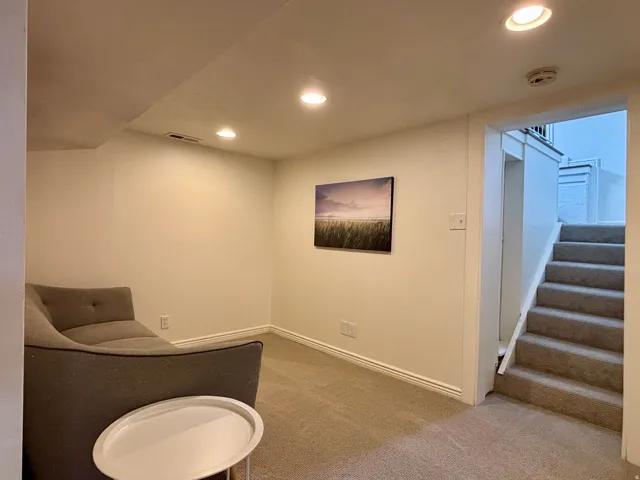 Carpeted room featuring recessed lighting and white trim