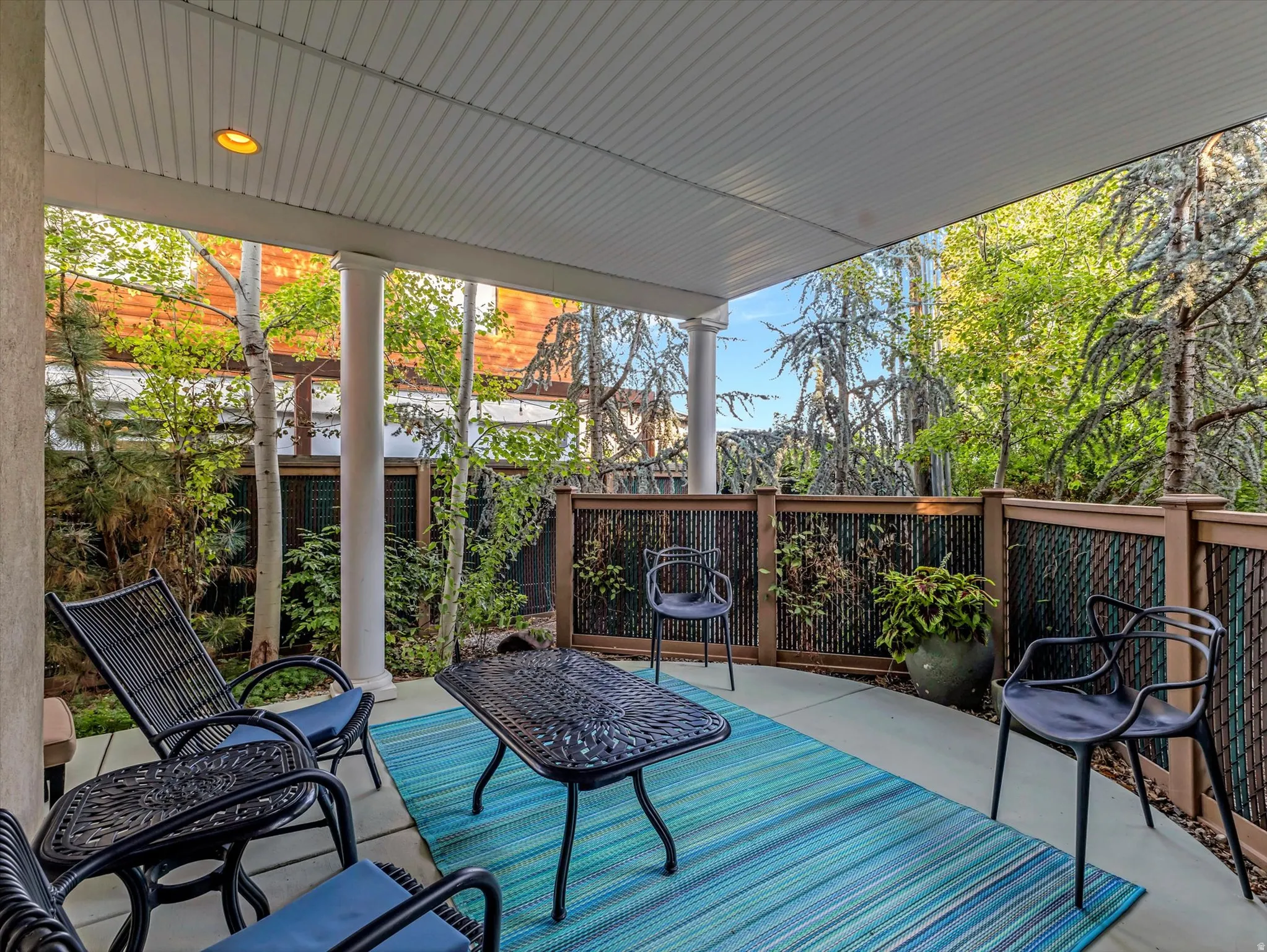 Wooden terrace featuring a patio area