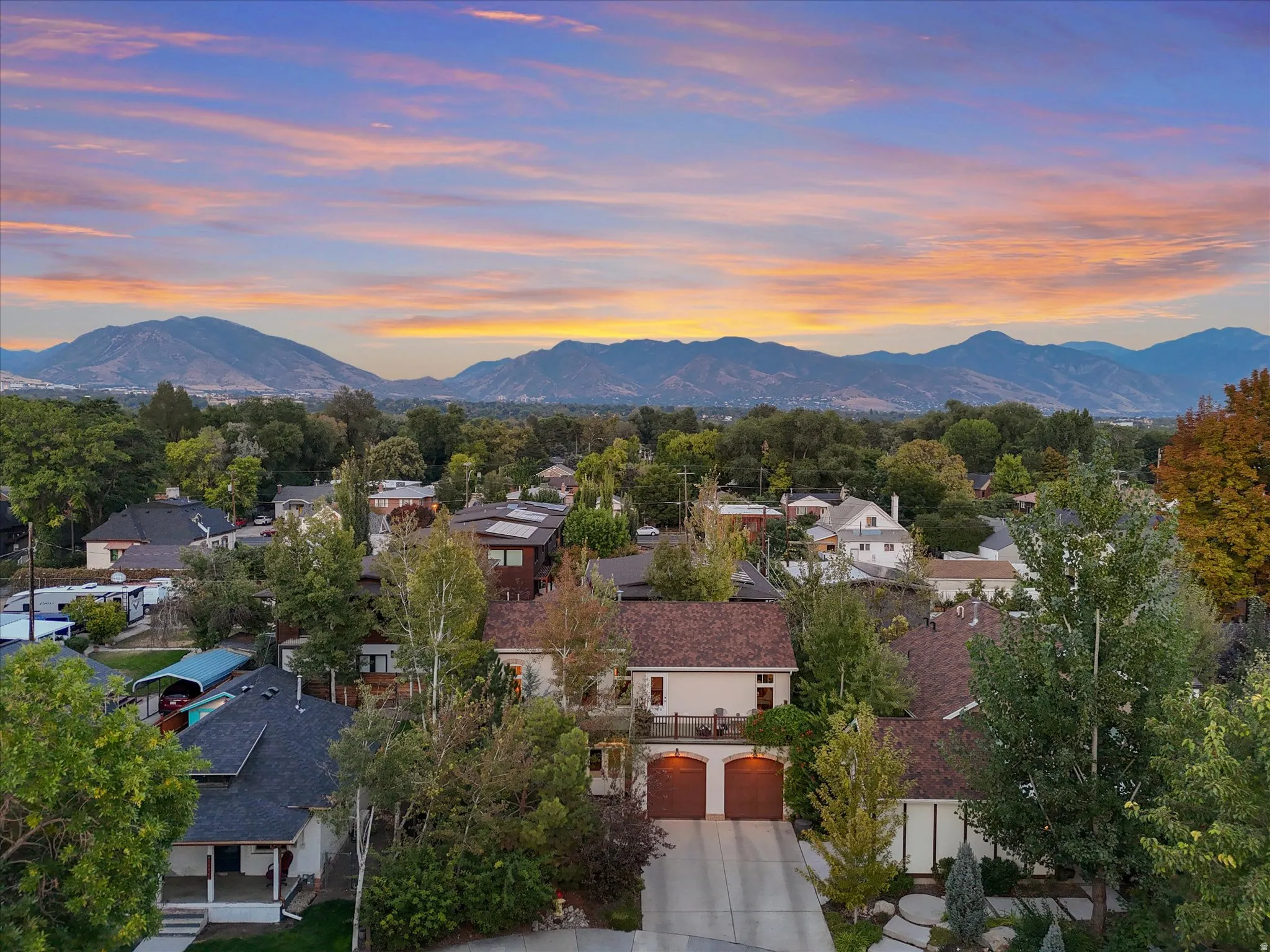 Aerial view at dusk of a mountain view and a residential view