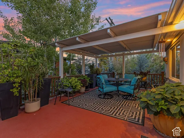 View of deck featuring a pergola and outdoor dining space