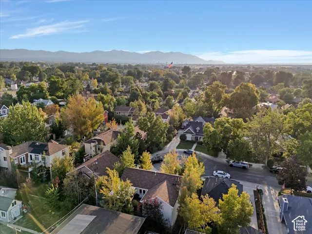 Aerial perspective of suburban area with a mountainous background