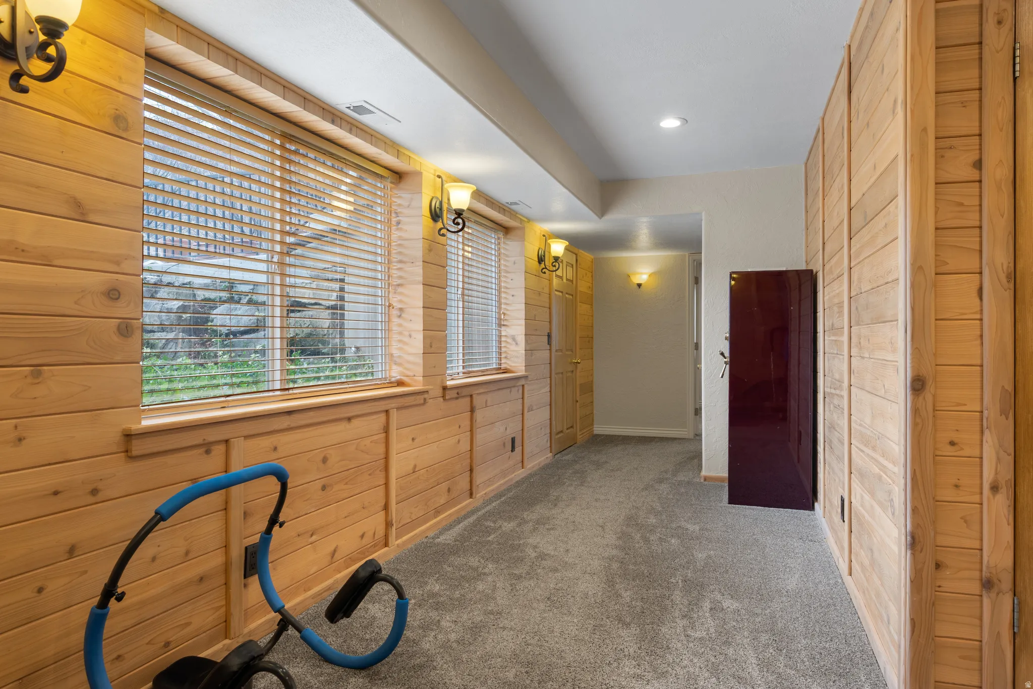 Basement Hall with wood paneled walls