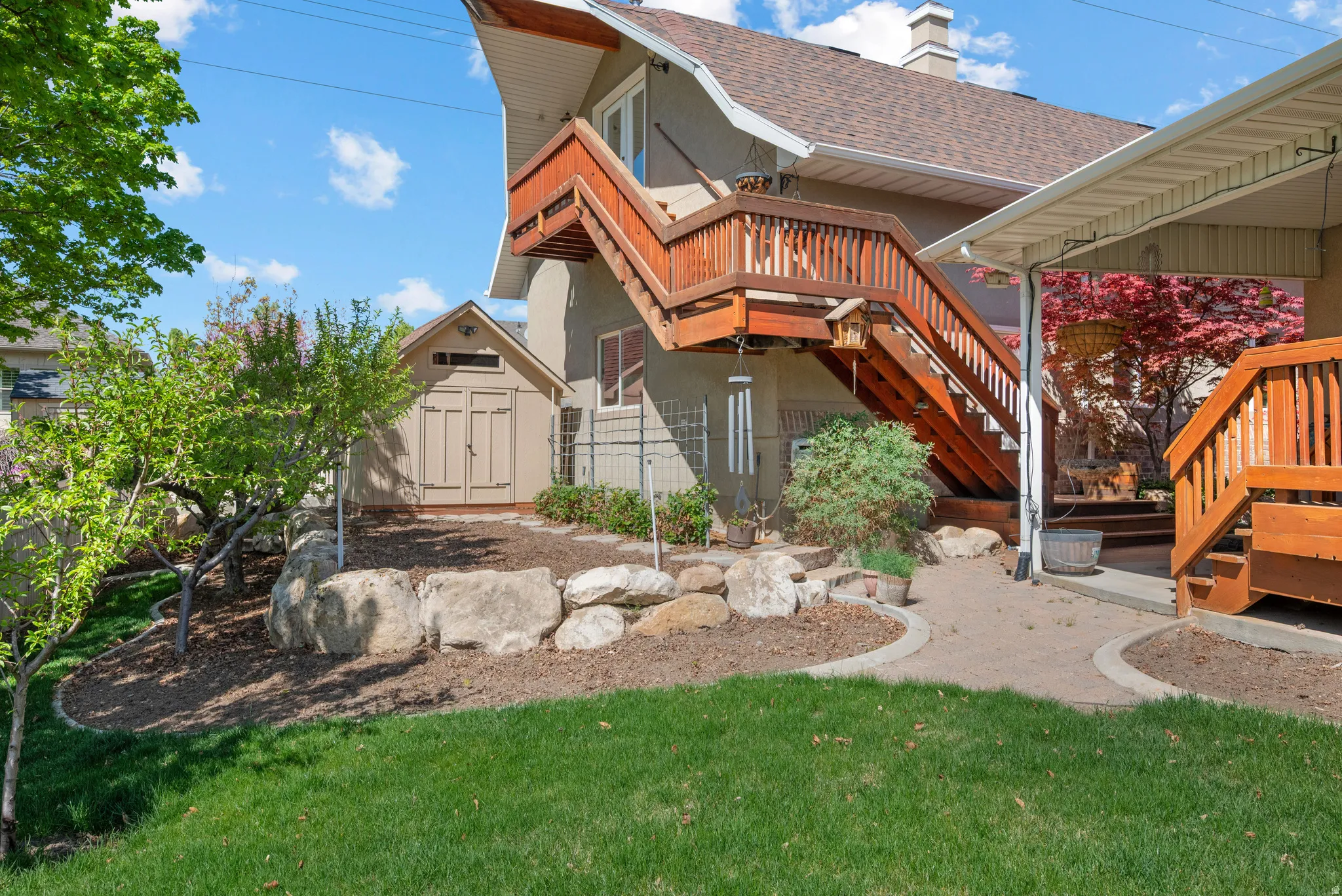 Rear view of detached garage and staircase to upstairs workshop.