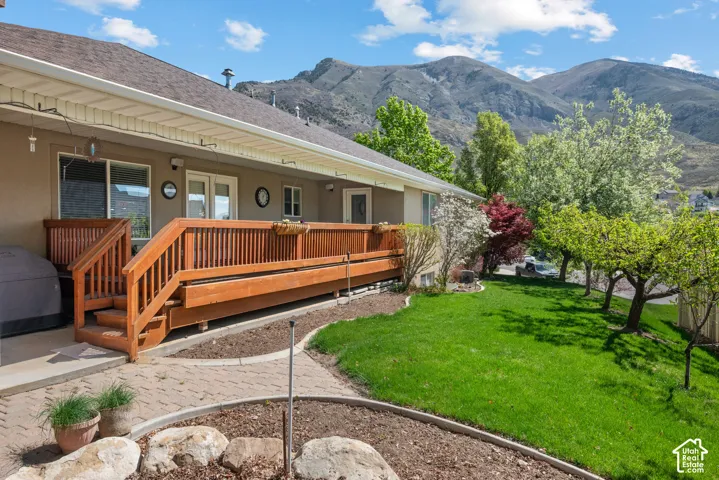 Rear exterior with a wood deck