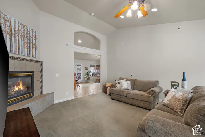 Open living space featuring vaulted ceilings and recessed lighting