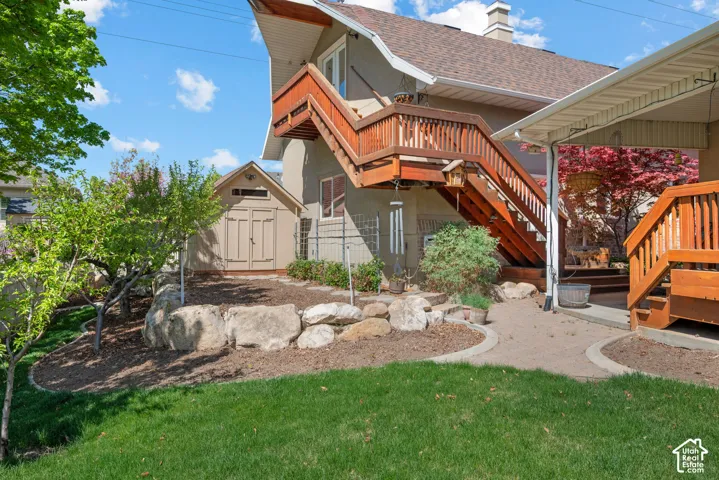 Rear view of detached garage and staircase to upstairs workshop.
